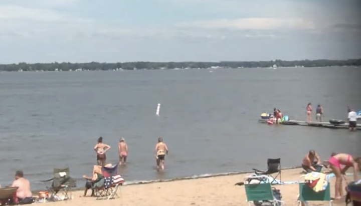 Sullivan Beach on Houghton Lake's east bay — sandy beach, dock, and boat launch